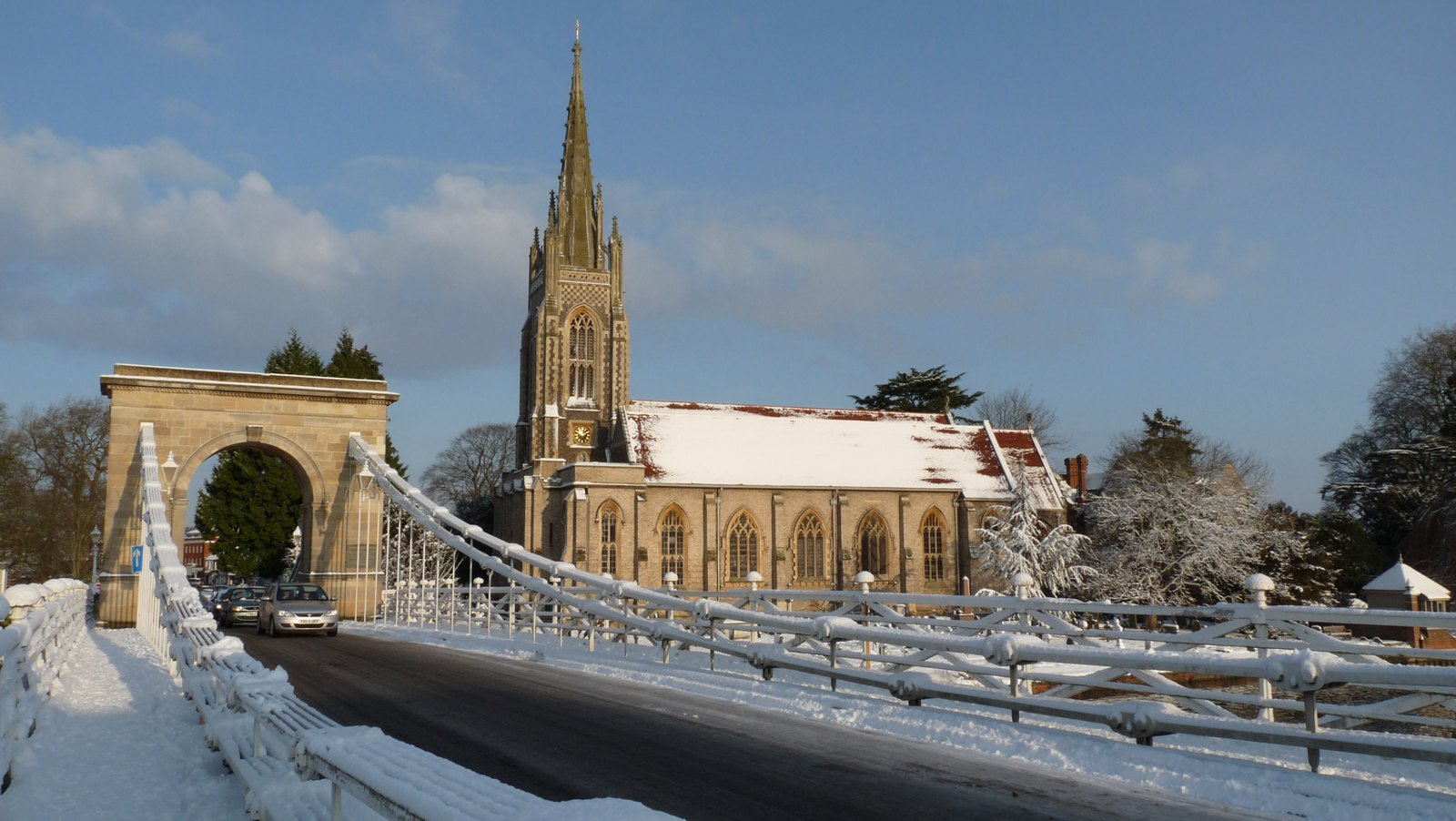 Marlow suspension bridge and All Saints' Church seen across the River Thames