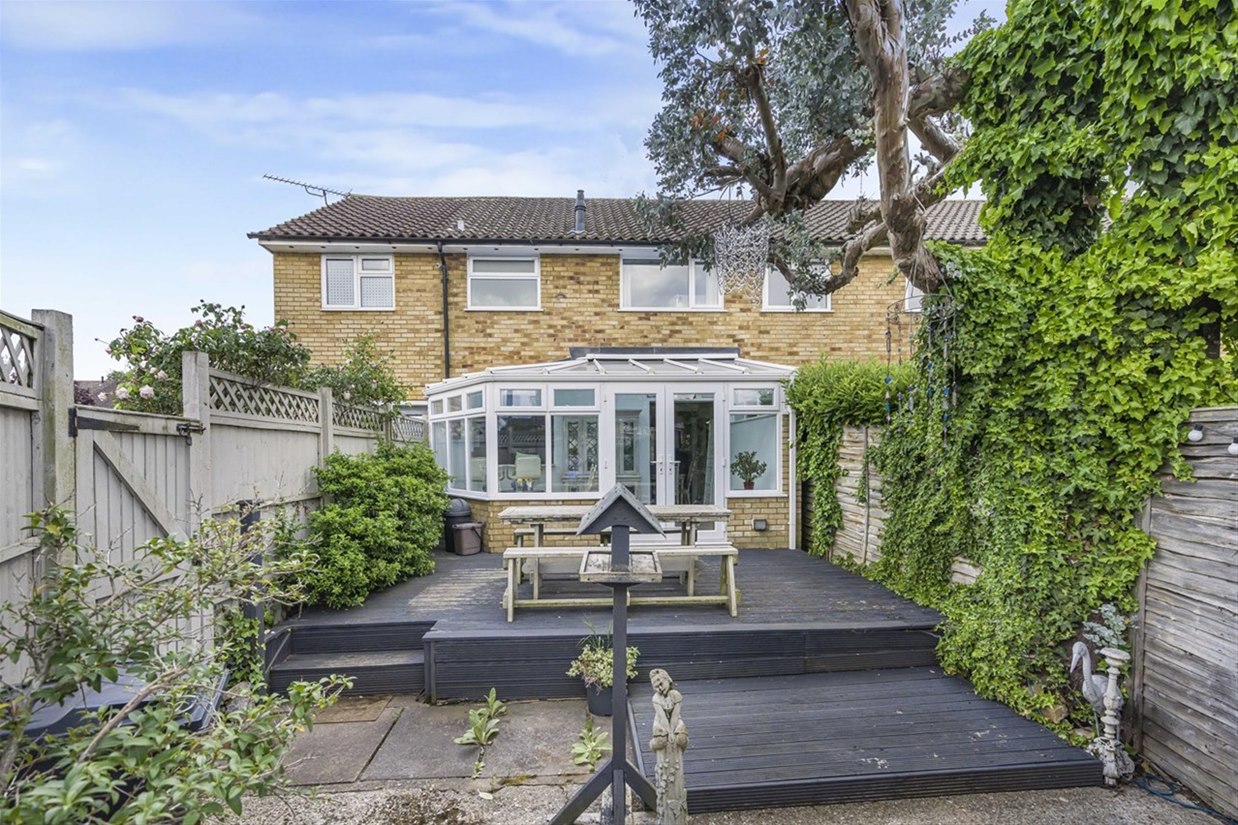 Rear elevation showing the conservatory and garden